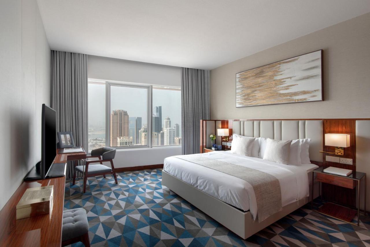 The Bentley Luxury Hotel & Suites Doha Exteriör bild A bedroom at the hotel
