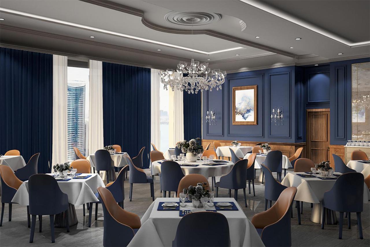 The Bentley Luxury Hotel & Suites Doha Exteriör bild The interior of the restaurant
